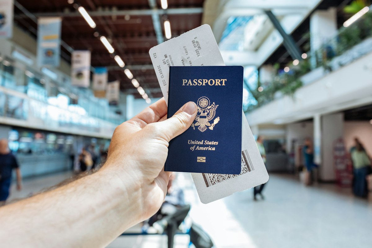 Traveller holding a passport at the airport